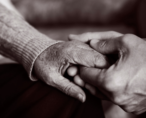 holding elderly person hand