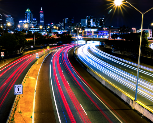 timelapse of highway going into city