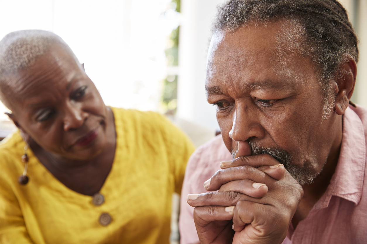how often does elder abuse occur? Elderly black couple talking about difficult subjects.