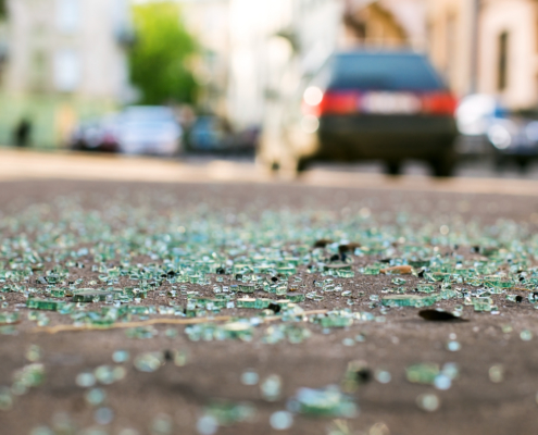 Who is responsible for car damage from road debris?