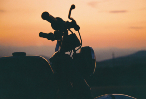 Motorcycle parked in front of a Florida sunset