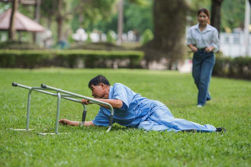 an elderly male patient uses it to help him walk and falls. An elderly man falls while learning to walk with a walker. A young woman and daughter run in to help support him. A patient falls.call our Fort Lauderdale nursing home abuse lawyer today