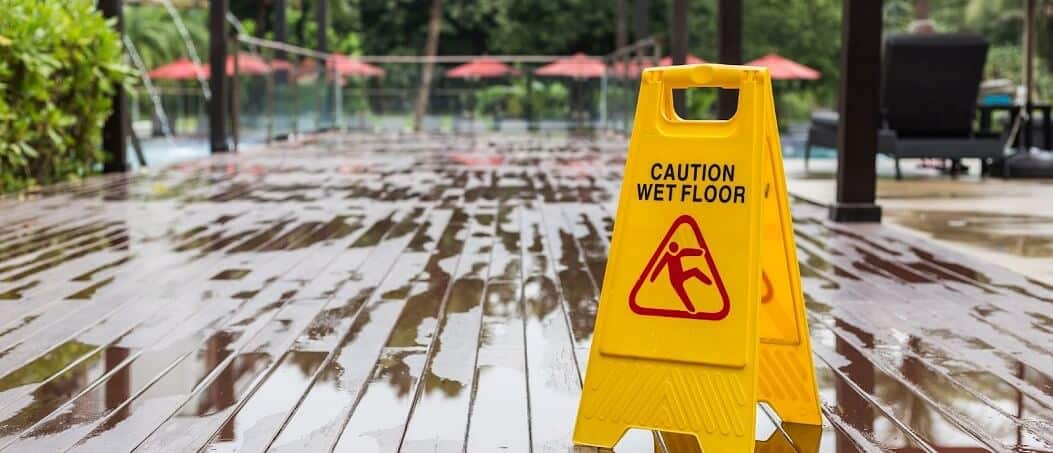 Fort Lauderdale Slip and Fall Lawyer - Wet Floor sign on wooden deck