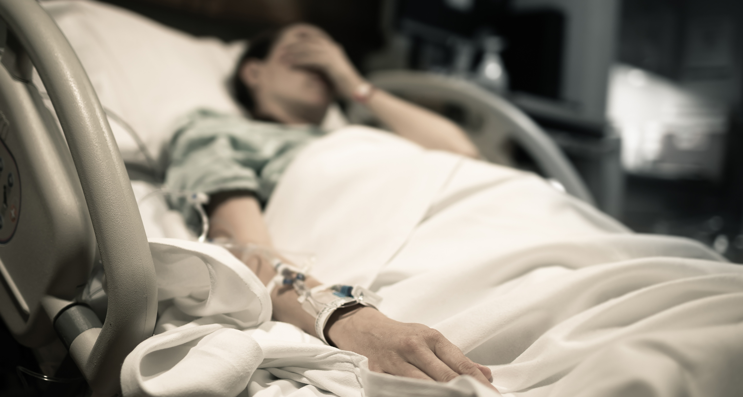 medical malpractice attorneys west palm beach - patient laying in a hospital bed experiencing grief after a birth injury