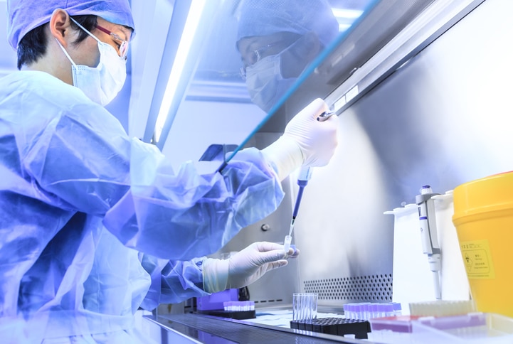 Doctor using medical devices in a lab