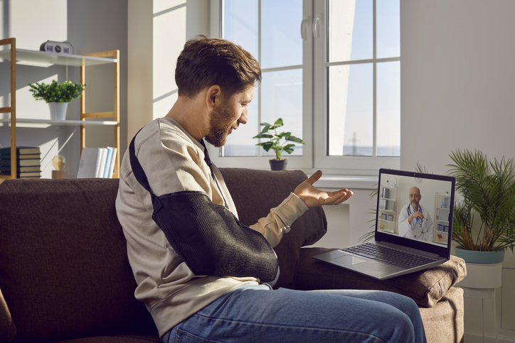 injured man talking to doctor via teleconference - how to know you have a strong personal injury claim