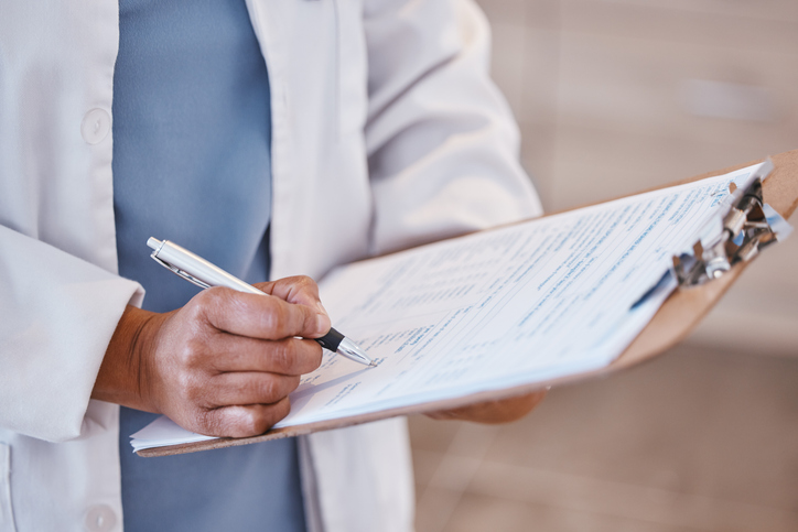 Doctor filling out a patient's medical chart - are medical errors considered malpractice?