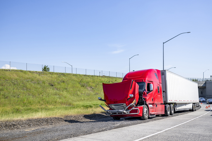 Semi truck stalled on the side of a highway - can I sue a company for a commercial truck accident injury?