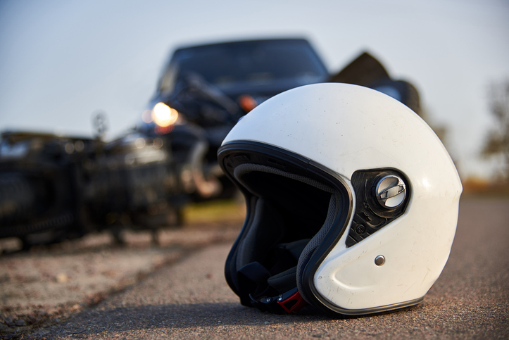 helmet and motorcycle on the road after a motorcycle accident - Boca Raton motorcycle accidents lawyer