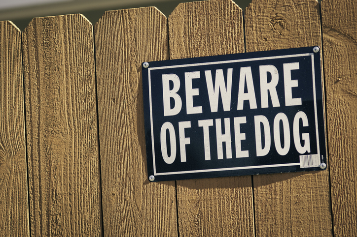 Beware of dog sign on a fence - dog bite attorney palm beach gardens