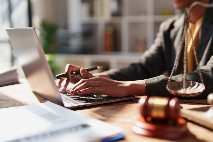 paralegal working on laptop - What do personal injury paralegals do?
