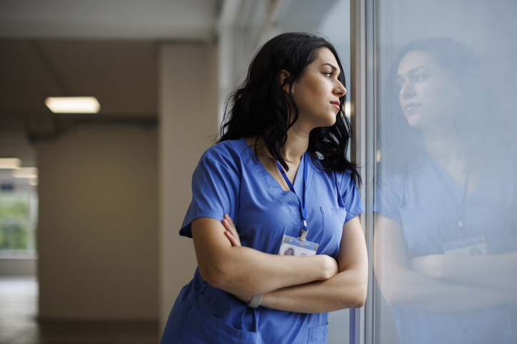 anxious nurse looking out a window - Can you claim for anxiety after a car accident?