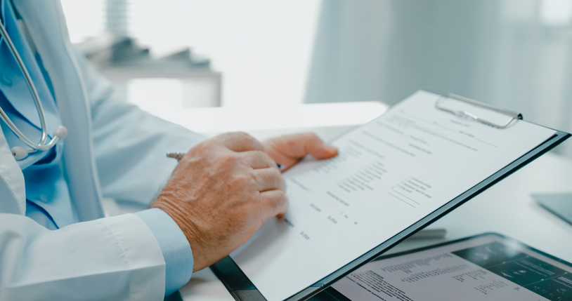 doctor filling out a form - what are NPDB medical malpractice payment reports?