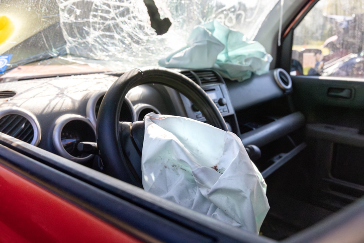 Driver-side airbag deployed in car crash - What happens when a car accident exceeds insurance limits?