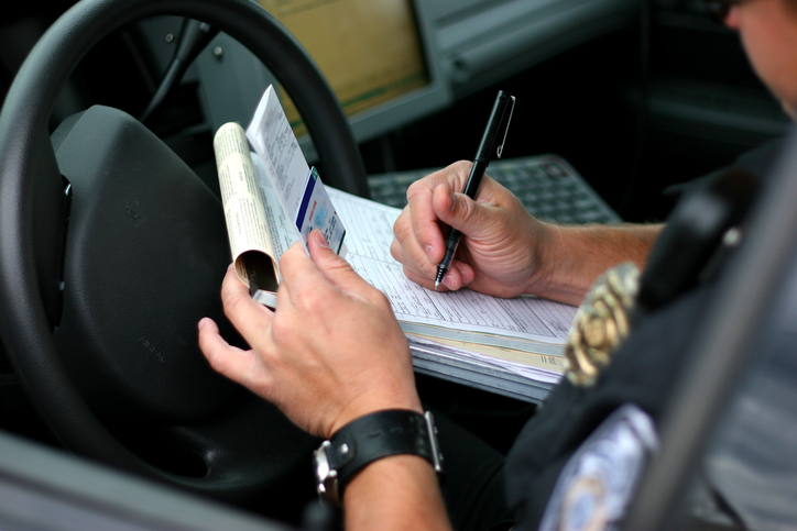 Police officer documenting accident - How to document your car accident injuries